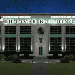 The front exterior of London hoover building at night with lights on